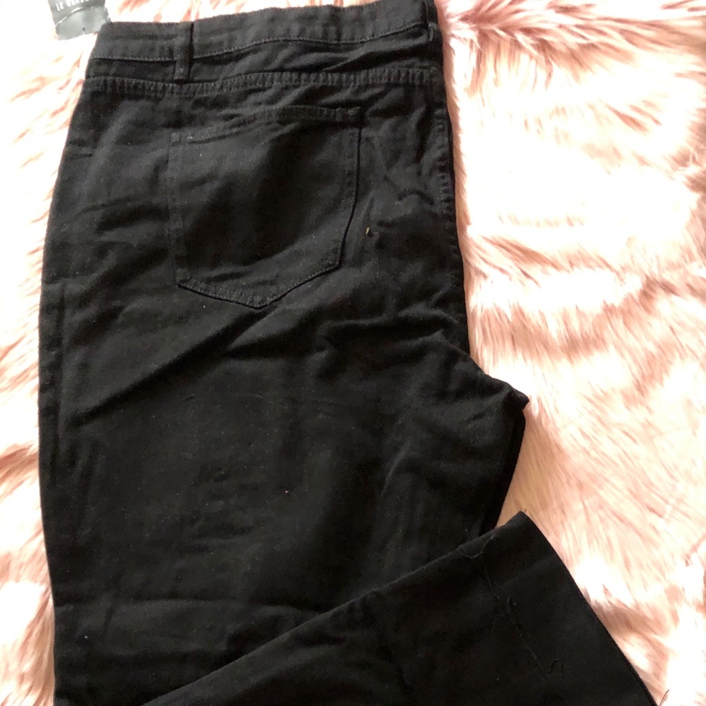 Black distressed jeans.